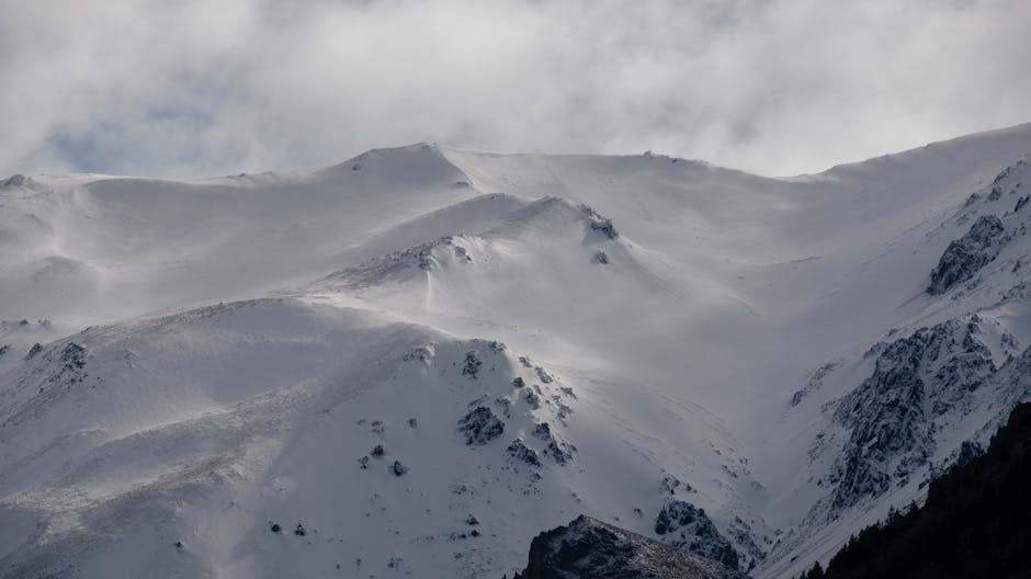 Breathtaking view of snow-covered mountains in Esquel, Argentina, showcasing winter's beauty
